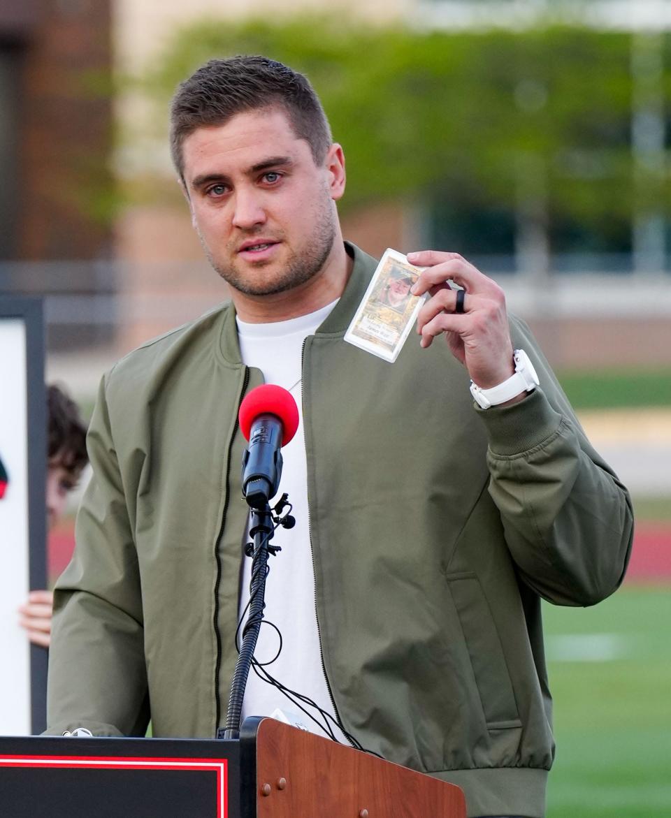 Derek Watt gets emotional talking about the love and support provided by his late grandfather, James Watt, during the jersey retirement ceremony at Pewaukee High School, Friday, May 5, 2023.