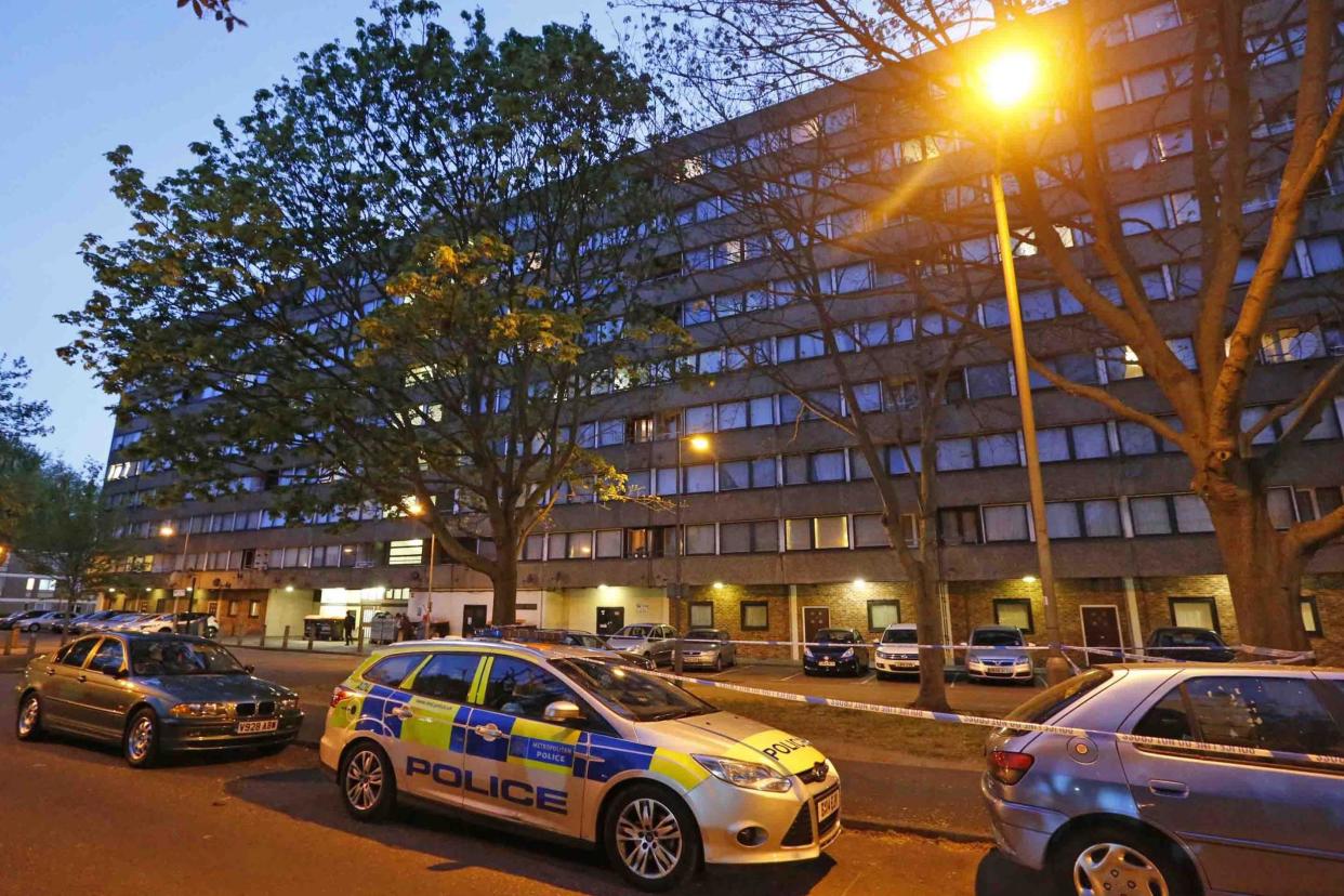 Crime scene: Police at the scene in Battersea after the attack: NIGEL HOWARD