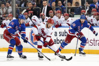 New York Rangers right wing Kaapo Kakko (24), left wing Will Cuylle (50) and Carolina Hurricanes center Jesperi Kotkaniemi (82) fight for the puck during the first period in Game 2 of an NHL hockey Stanley Cup second-round playoff series, Tuesday, May 7, 2024, in New York. (AP Photo/Julia Nikhinson)