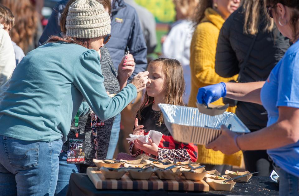 Foodies taste samples during Pensacola EggFest at Blue Wahoos Stadium Sunday, November 13, 2022. The event hosts BBQ teams and backyard cooks who share the love of cooking and the joy of giving back to their communities. Since 2013 over $500,000 has been donated to local charities.