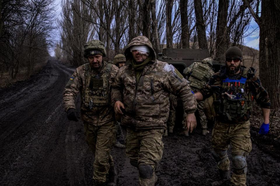 Ukrainian combat medics evacuate a wounded Ukrainian servicemen from the front line near Bakhmut, Ukraine, on March 8, 2023. (Sergey Shestak/AFP via Getty Images)