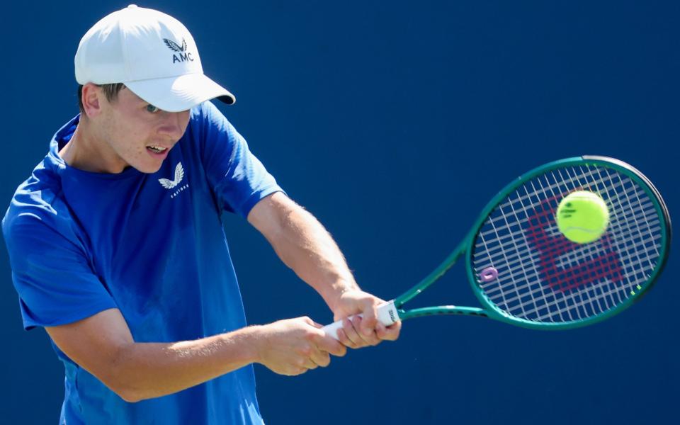 Charlie Robertson of Great Britain makes a return against Jangjun Kim of South Korea during their junior boys' singles third round match at the US Open, September 4, 2024