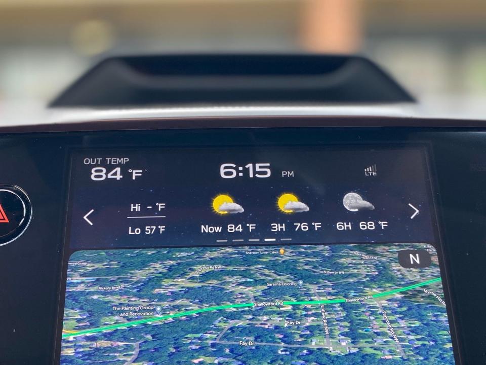Subaru integrated weather, audio, and navigation information into a strip at the top of the infotainment screen.