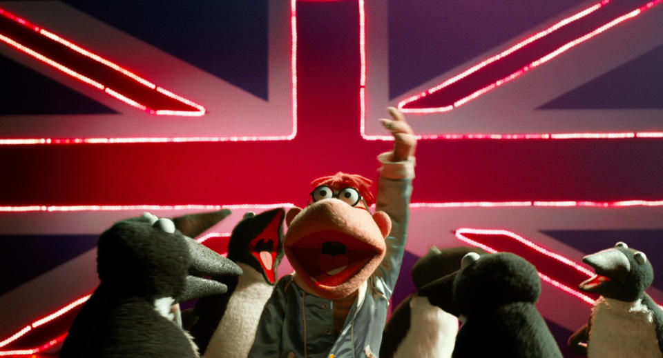 This image released by Disney shows the character Scooter, center, in a scene from "Muppets Most Wanted." (AP Photo/Disney Enterprises, Inc.)