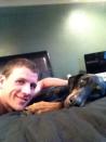 Ryan Lochte hanging out in bed with his dog Carter.