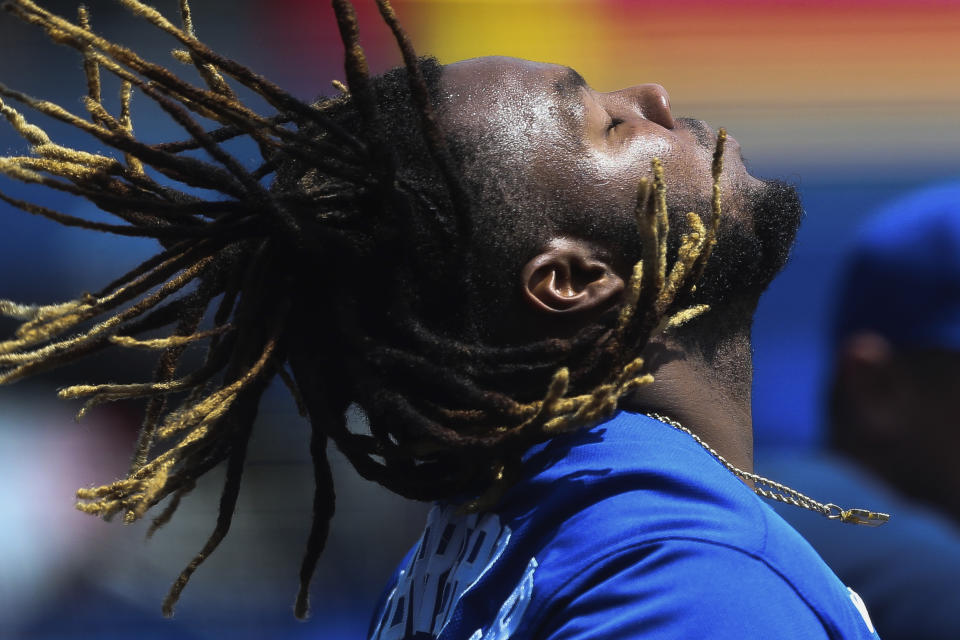 Toronto Blue Jays' Vladimir Guerrero Jr. throws his head back before putting on his batting helmet during the fifth inning of a baseball game against the Baltimore Orioles in Buffalo, N.Y., Sunday, June 27, 2021. (AP Photo/Joshua Bessex)