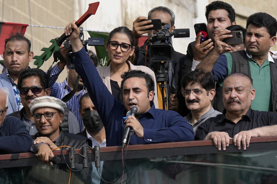 Bilawal Bhutto Zardari, center, Chairman of Pakistan People's Party, raises his party's election symbol as he addresses to his supporters during an election campaign rally, in Karachi, Pakistan, Monday, Feb. 5, 2024. (AP Photo/Fareed Khan)