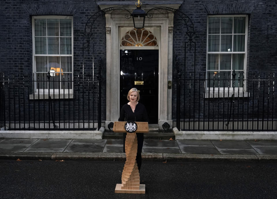 FILE - British Prime Minister Liz Truss makes a statement regarding the death of Queen Elizabeth II outside Downing Street in London, Thursday, Sept. 8, 2022. British Prime Minister Liz Truss took office less than two weeks ago, impatient to set her stamp on government. The death of Queen Elizabeth II ripped up Truss’s carefully laid plans for the first weeks of her term, putting everyday politics in the U.K. on hold as the country was plunged into official and emotional mourning. (AP Photo/Alberto Pezzali, File)