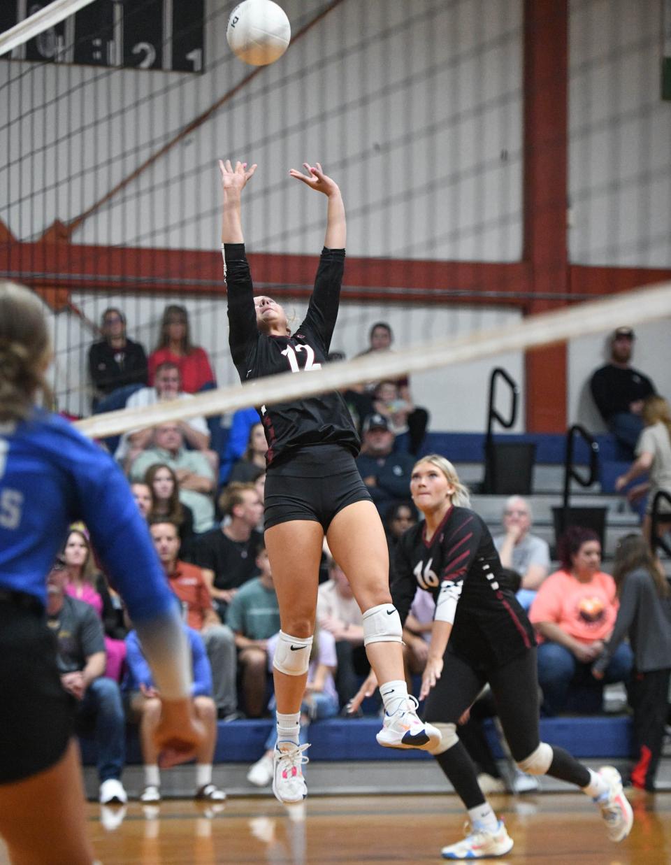 Lily Adams (12) plays the ball during the Baker vs Jay 1-1A District Tournament championship volleyball match at Jay High School on Thursday, Oct. 19, 2023.