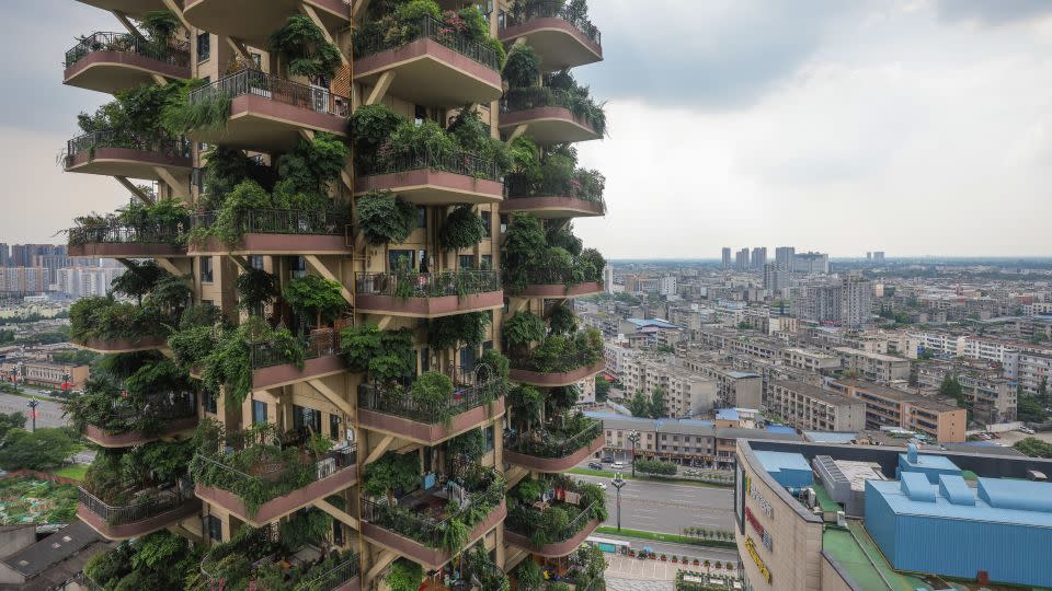 This photo taken on July 12, 2021 shows an apartment block with balconies covered with plants at a residential community in Chengdu in China's southwestern Sichuan province. - STR/AFP/AFP via Getty Images