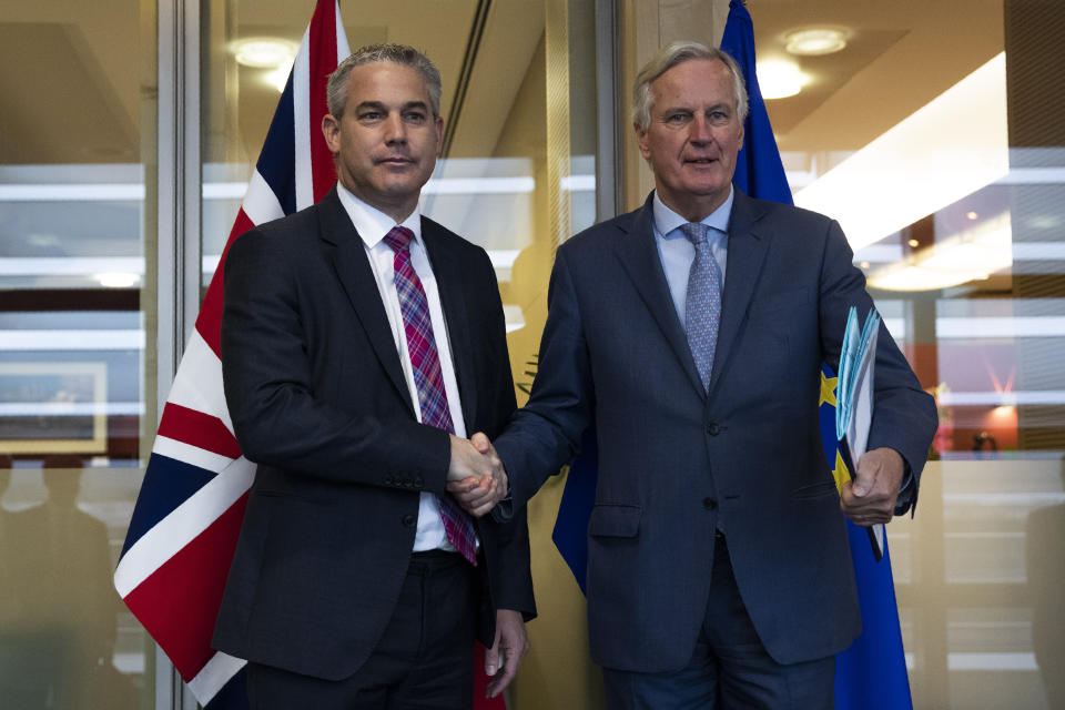UK Brexit secretary Stephen Barclay, left, shakes hands with European Union chief Brexit negotiator Michel Barnier before their meeting at the European Commission headquarters in Brussels, Friday, Oct. 11, 2019