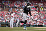 Miami Marlins' Nick Gordon, right, celebrates after hitting a three-run home run off St. Louis Cardinals starting pitcher Kyle Gibson, left, during the first inning of a baseball game Sunday, April 7, 2024, in St. Louis. (AP Photo/Jeff Roberson)