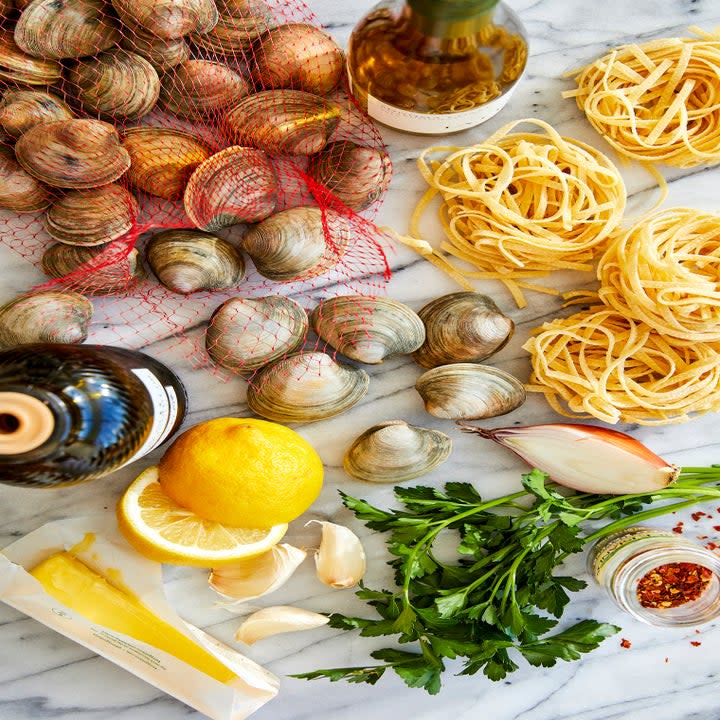 Ingredients for linguine and clams on a table