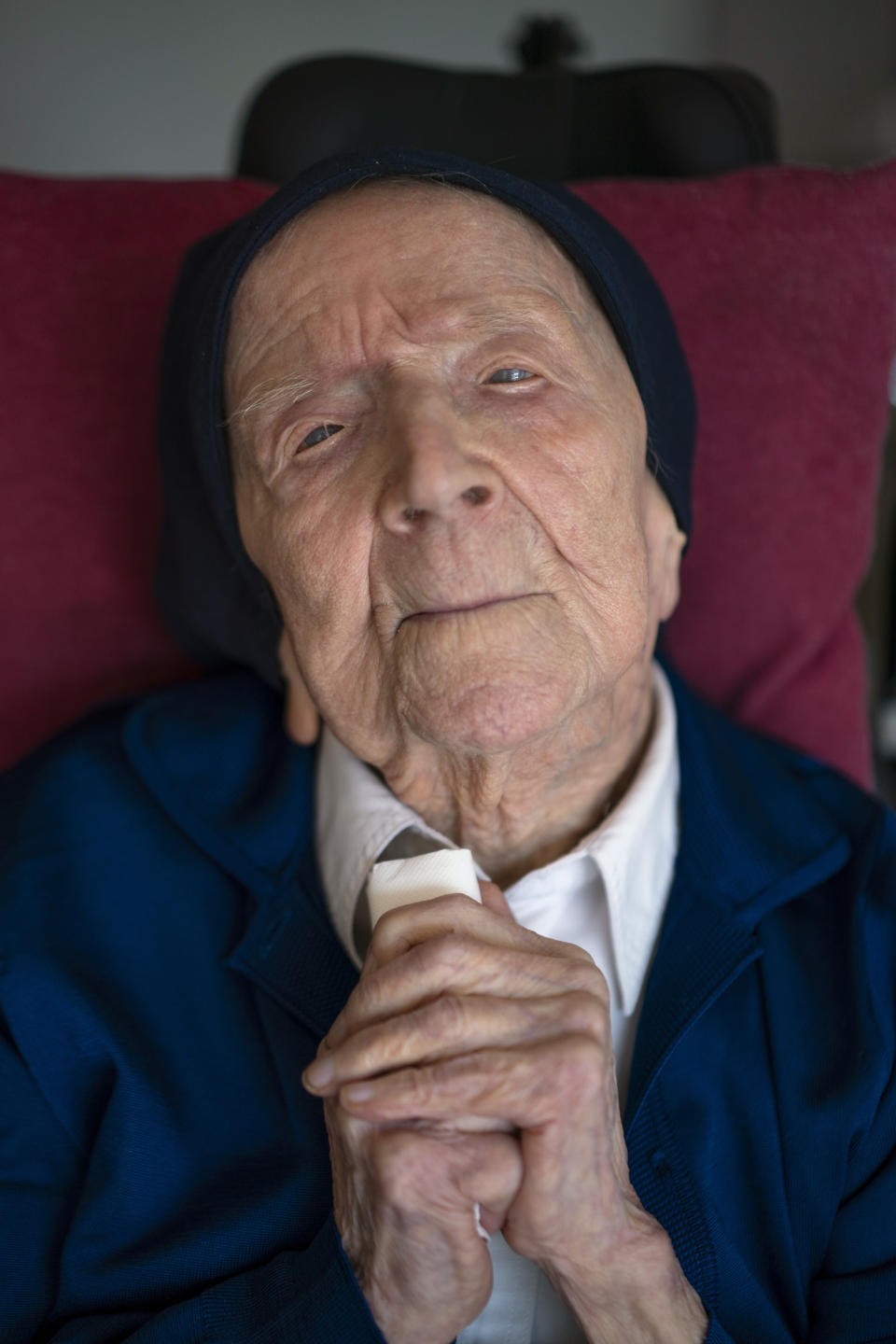 Sister Andre poses for a portrait at the Sainte Catherine Laboure care home in Toulon, southern France, Wednesday, April 27, 2022. The French nun who was believed to be the world's oldest person died at 118 in her sleep early Tuesday Jan.17, 2023, the spokesperson for her nursing home in Toulon, David Tavella, said Wednesday. (AP Photo/Daniel Cole, File)