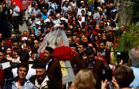 People dressed in folk costumes take part in a traditional wedding ceremony in the village of Galicnik, west of capital Skopje, Macedonia July 15, 2018. REUTERS/Ognen Teofilovski