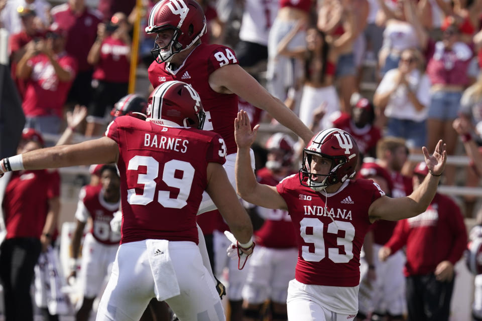 Indiana place kicker Charles Campbell (93) celebrates after kicking the game winning field goal during overtime of an NCAA college football game against Western Kentucky, Saturday, Sept. 17, 2022, in Bloomington, Ind. Indiana won 33-30 in overtime. (AP Photo/Darron Cummings)