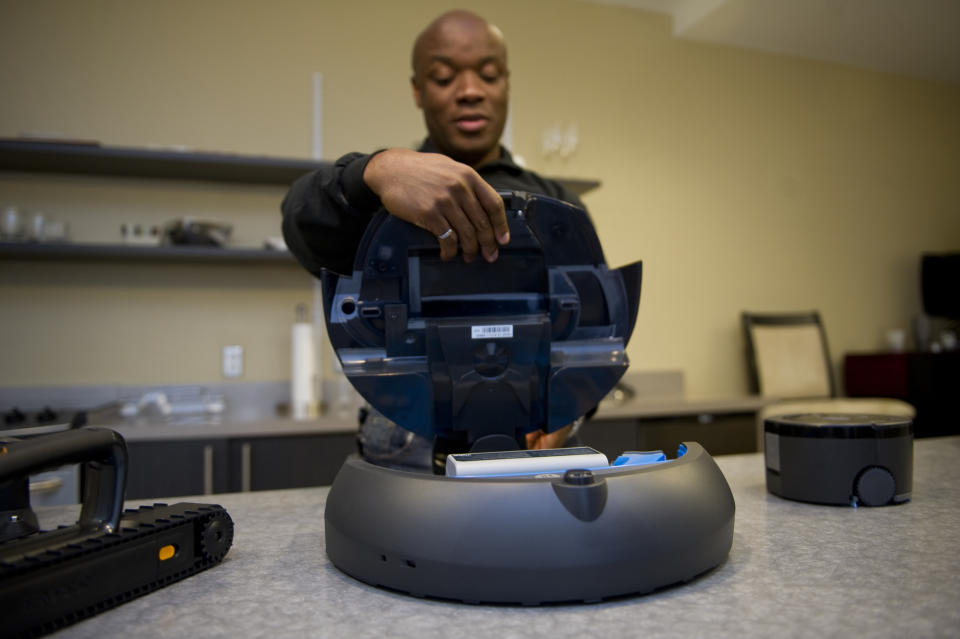 BEDFORD, MA - AUGUST 24: The features of the iRobot Roomba are demonstrated by an iRobot employee in a show room at the iRobot offices, on August 24, 2012 in Bedford, Massachusetts.The Roomba, a robotic vacuum cleaner, is one of a series of cleaning robots made by iRobot. (Photo by Ann Hermes/The Christian Science Monitor via Getty Images)