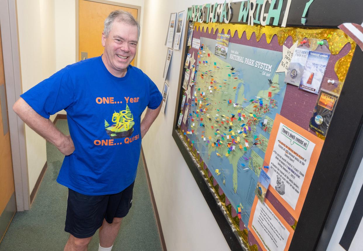 Thomas Wright, who visited every U.S. national park this year, poses with a map of his travels while at NovaCare Rehabilitation in Hartville.