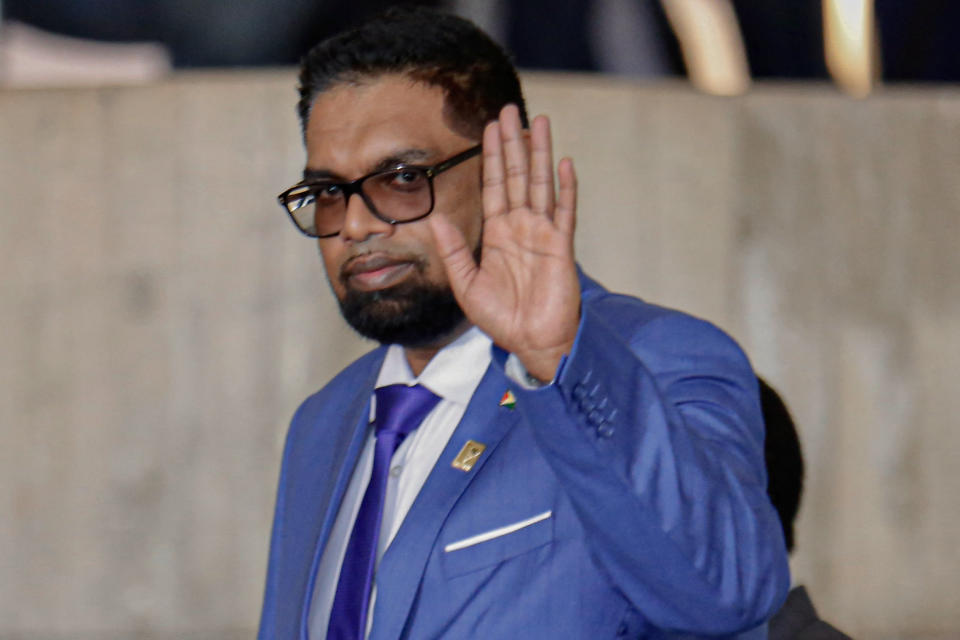 Guyana's President Irfaan Ali waves to journalists upon arrival at Itamaraty palace in Brasilia on May 30, 2023. Brazilian President Luiz Inacio Lula da Silva is hosting his fellow South American leaders Tuesday for a 