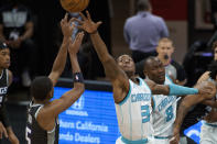 Charlotte Hornets guard Terry Rozier (3) attempts to block a shot by Sacramento Kings guard De'Aaron Fox (5) during the first quarter of an NBA basketball game in Sacramento, Calif., Sunday, Feb. 28, 2021. (AP Photo/Randall Benton)