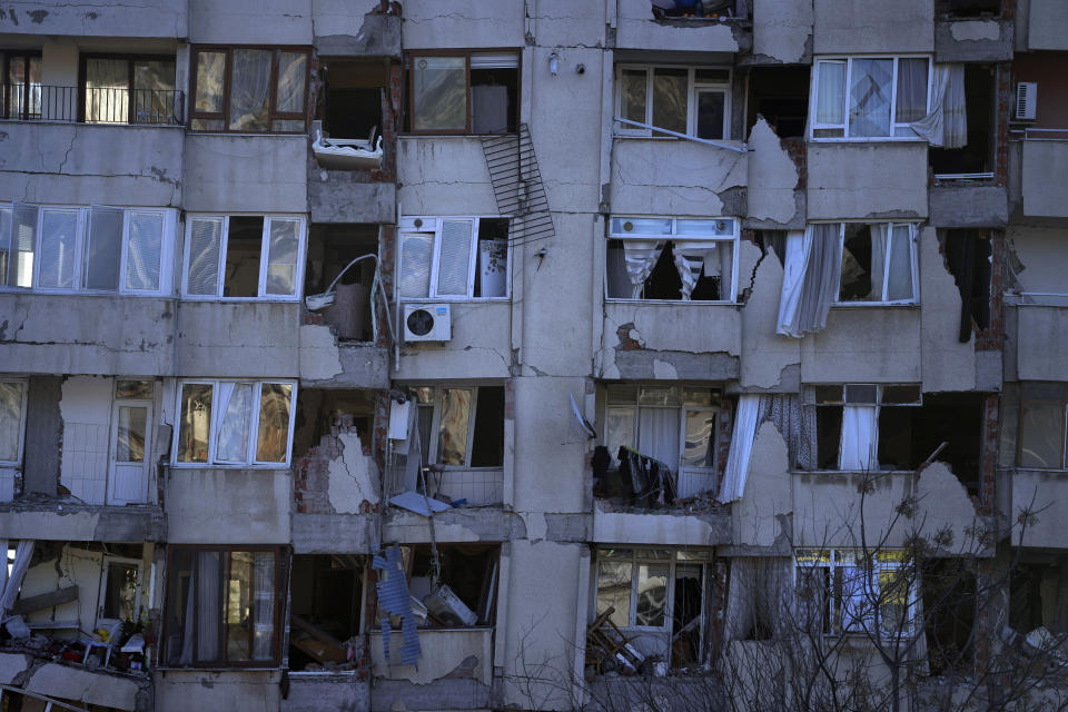 FILE - A destroyed building in Antakya, southern Turkey, Wednesday, Feb. 8, 2023. For Syrians and Ukrainians fleeing the violence back home, the earthquake that struck in Turkey and Syria is but the latest tragedy. The U.N. says Turkey hosts about 3.6 million Syrians who fled their country’s 12-year civil war, along with close to 320,000 people escaping hardships from other countries. (AP Photo/Khalil Hamra, File)