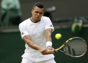 Jo-Wilfried Tsonga of France hits the ball during his match against Albert Ramos-Vinolas of Spain at the Wimbledon Tennis Championships in London, July 2, 2015. REUTERS/Henry Browne