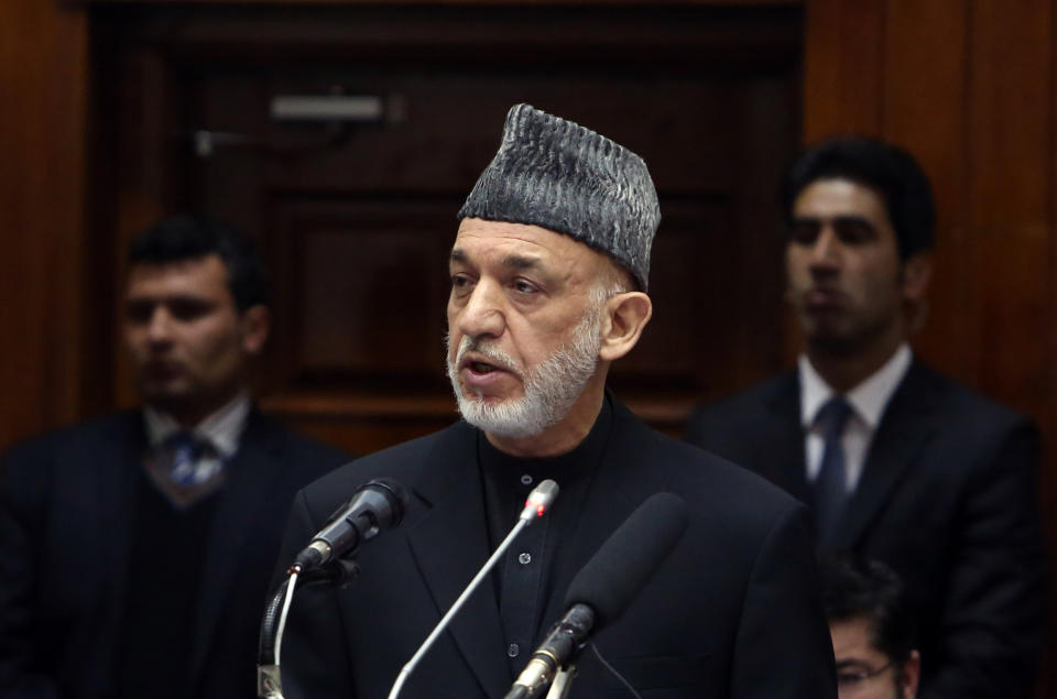 Afghan President Hamid Karzai speaks during his final address to parliament during its opening session at the parliament house in Kabul, Afghanistan, Saturday, March 15, 2014. Karzai said the last 12 years of war were "imposed" on Afghans, a reference to the U.S.-led invasion that ousted the Taliban. (AP Photo/Rahmat Gul)