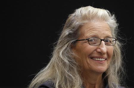 U.S. photographer Annie Leibovitz smiles during a media preview ceremony prior to the opening of her exhibition in Moscow October 11, 2011. REUTERS/Sergei Karpukhin