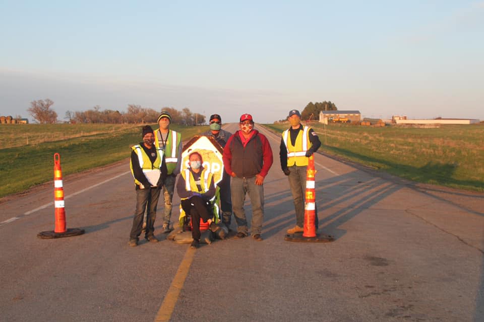 Cheyenne River Chairman Harold Frazier, second from the right, stands with tribal law enforcement at a checkpoint on Friday.