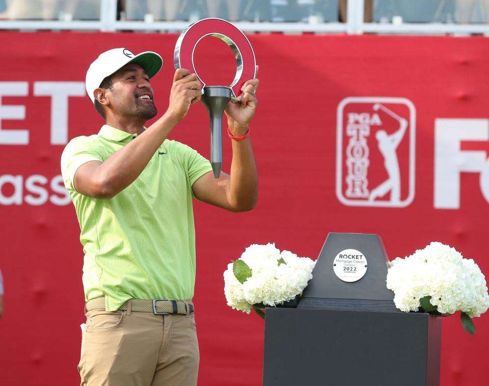 Tony Finau celebrates winning the Rocket Mortgage Classic at the Detroit Golf Club Sunday, July 31, 2022.