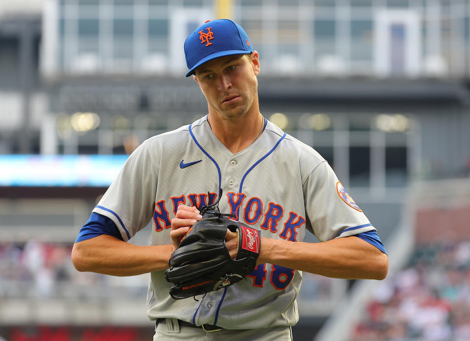 ATLANTA, GEORGIA - AUGUST 18:  Jacob deGrom #48 of the New York Mets reacts after the first inning against the Atlanta Braves at Truist Park on August 18, 2022 in Atlanta, Georgia. (Photo by Kevin C. Cox/Getty Images)