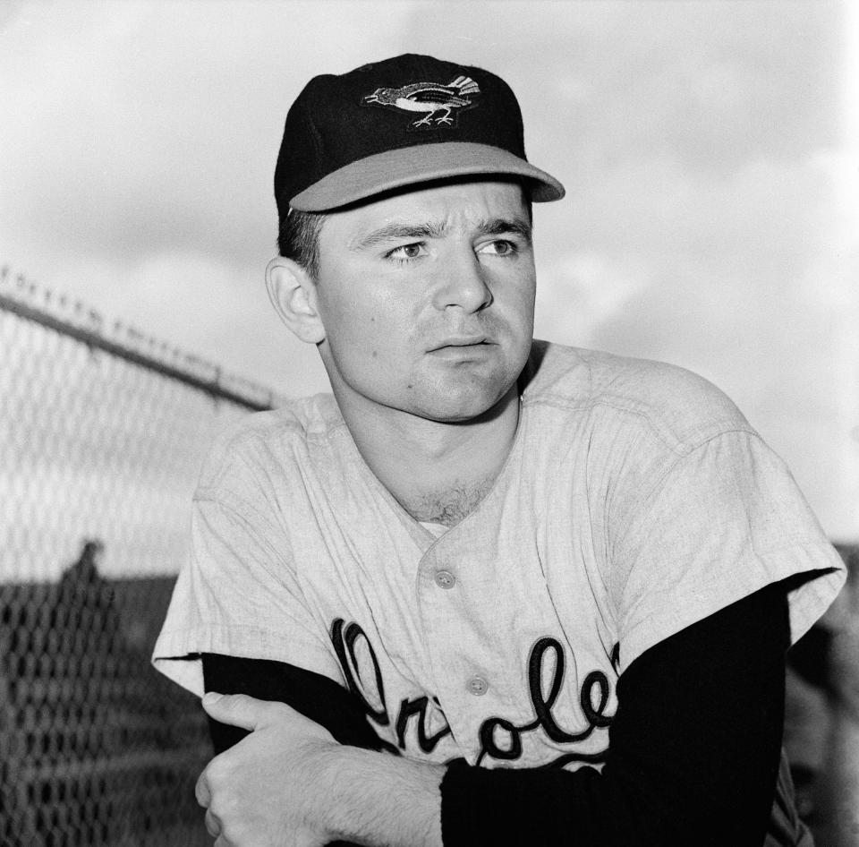 FILE - This is a 1959 file photo showing Baltimore Orioles minor league pitcher Steve Dalkowski posed in Miami, Fla. Dalkowski, a hard-throwing, wild left-hander who inspired the creation of the character Nuke LaLoosh in the movie "Bull Durham" but never pitched in a big league game, died April 19, 2020, at the Hospital of Central Connecticut in New Britain. He was 80. His sister, Patricia Cain, said Friday, April 24, 2020, he had several pre-existing conditions that were complicated when he became infected with the novel coronavirus. (AP Photo/File)