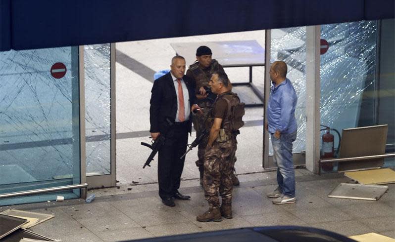 Armed security stand at an entrance of Turkey's largest airport, Istanbul Ataturk. REUTERS/Osman Orsal