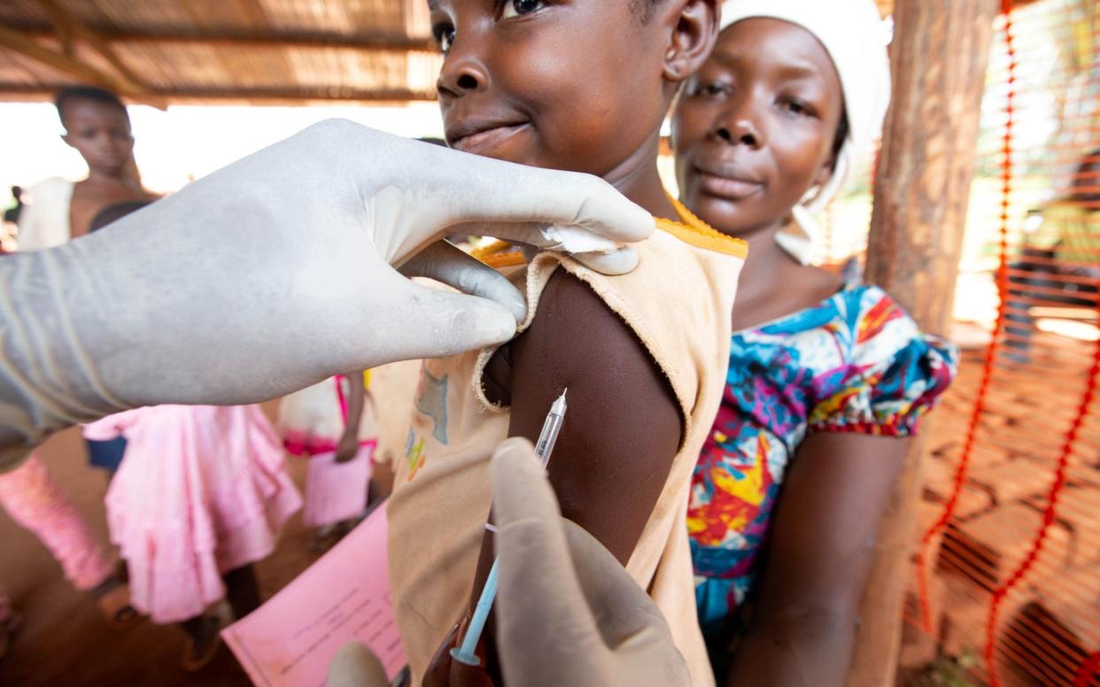 A child receives a measles vaccination in a campaign run by Medecins sans Frontieres in Democratic Republic of Congo - Hereward Holland /Reuters