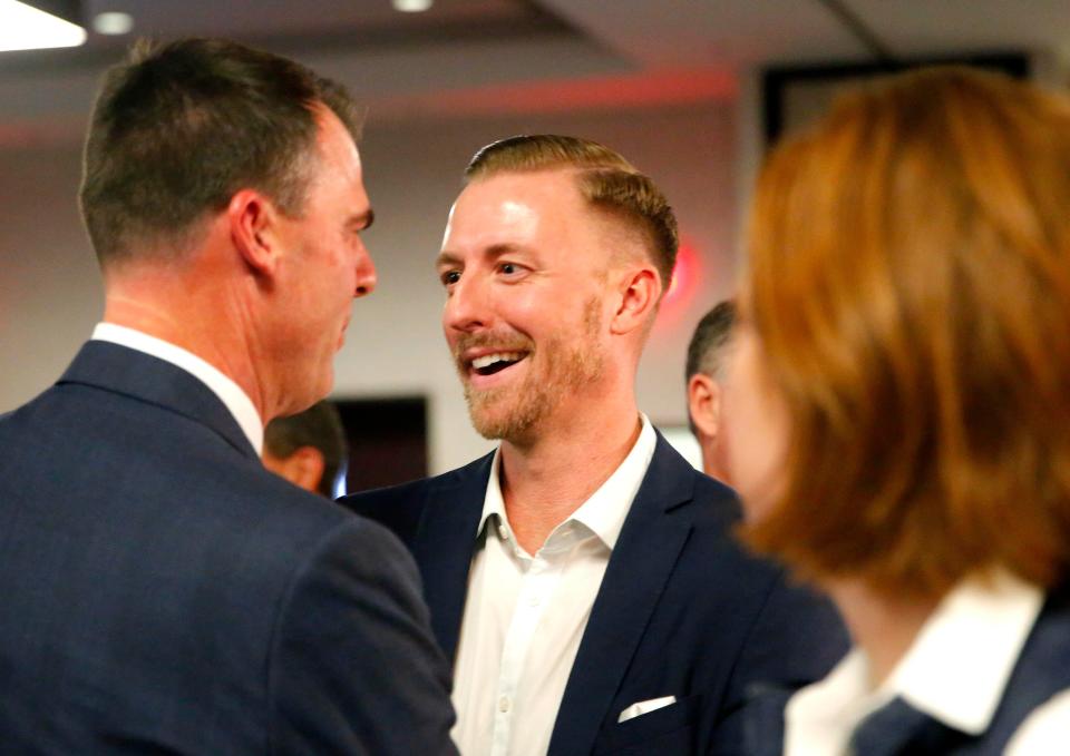 Ryan Walters congratulates Gov. Kevin Stitt during a GOP election night watch party on Nov. 8, 2022, in Oklahoma City.