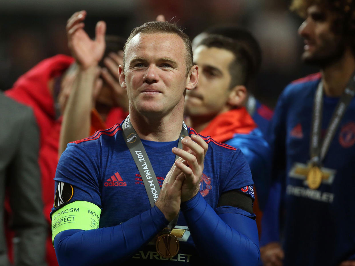 Wayne Rooney celebrates after the final at the Friends Arena: Getty