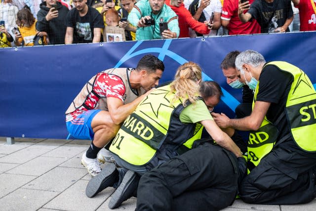 Cristiano Ronaldo checks on a steward