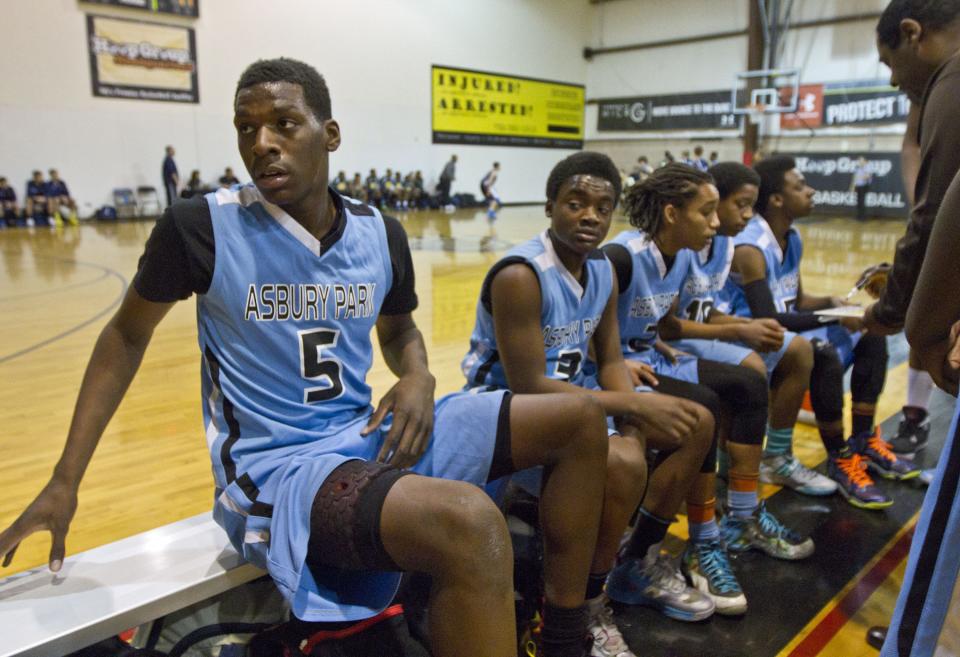 Naz Reid (5) sits with his Asbury Park Middle School teammates during a tournament at the Hoop Group in Neptune in 2014.