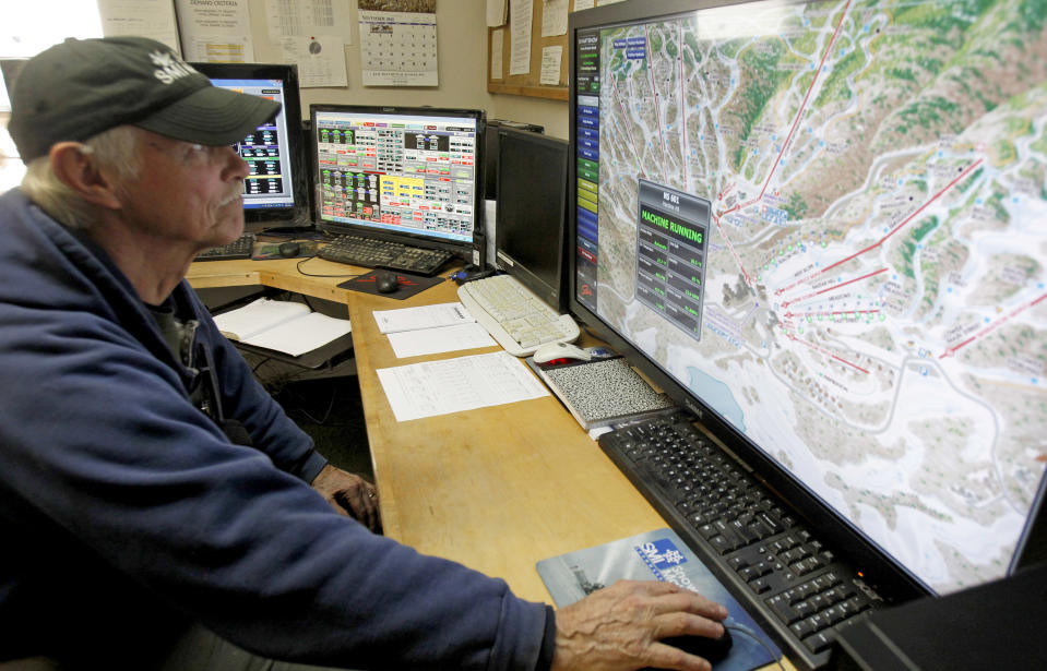 This Nov. 15, 2012 photo shows Norm White at the controls of the sophisticated snow-making system at the Stowe resort in Stowe, Vt. The ground might be bare, but ski areas across the Northeast are making big investments in high-efficiency snowmaking so they can open more terrain earlier and longer. (AP Photo/Toby Talbot)