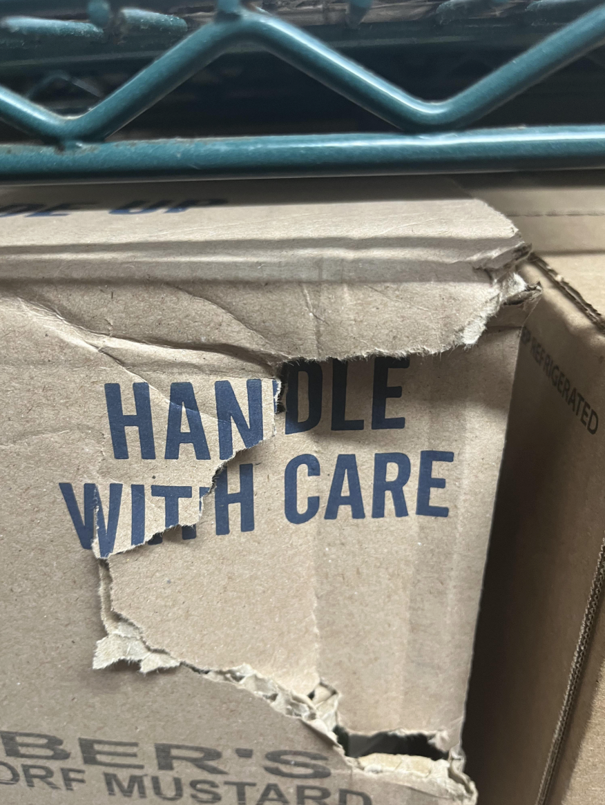 handle with care package is ripped