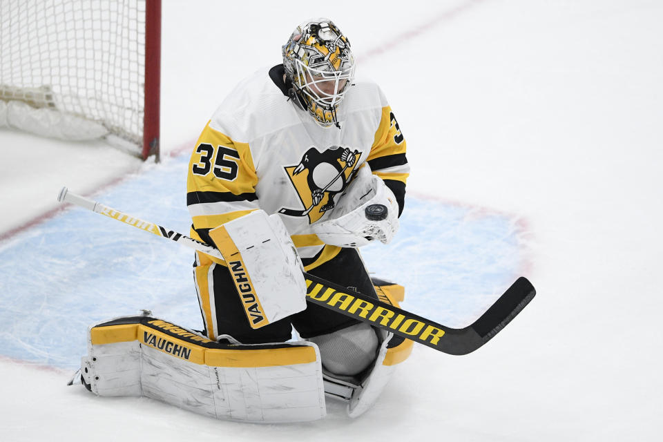 Pittsburgh Penguins goaltender Tristan Jarry stops the puck during the first period of the team's NHL hockey game against the Washington Capitals, Saturday, May 1, 2021, in Washington. (AP Photo/Nick Wass)