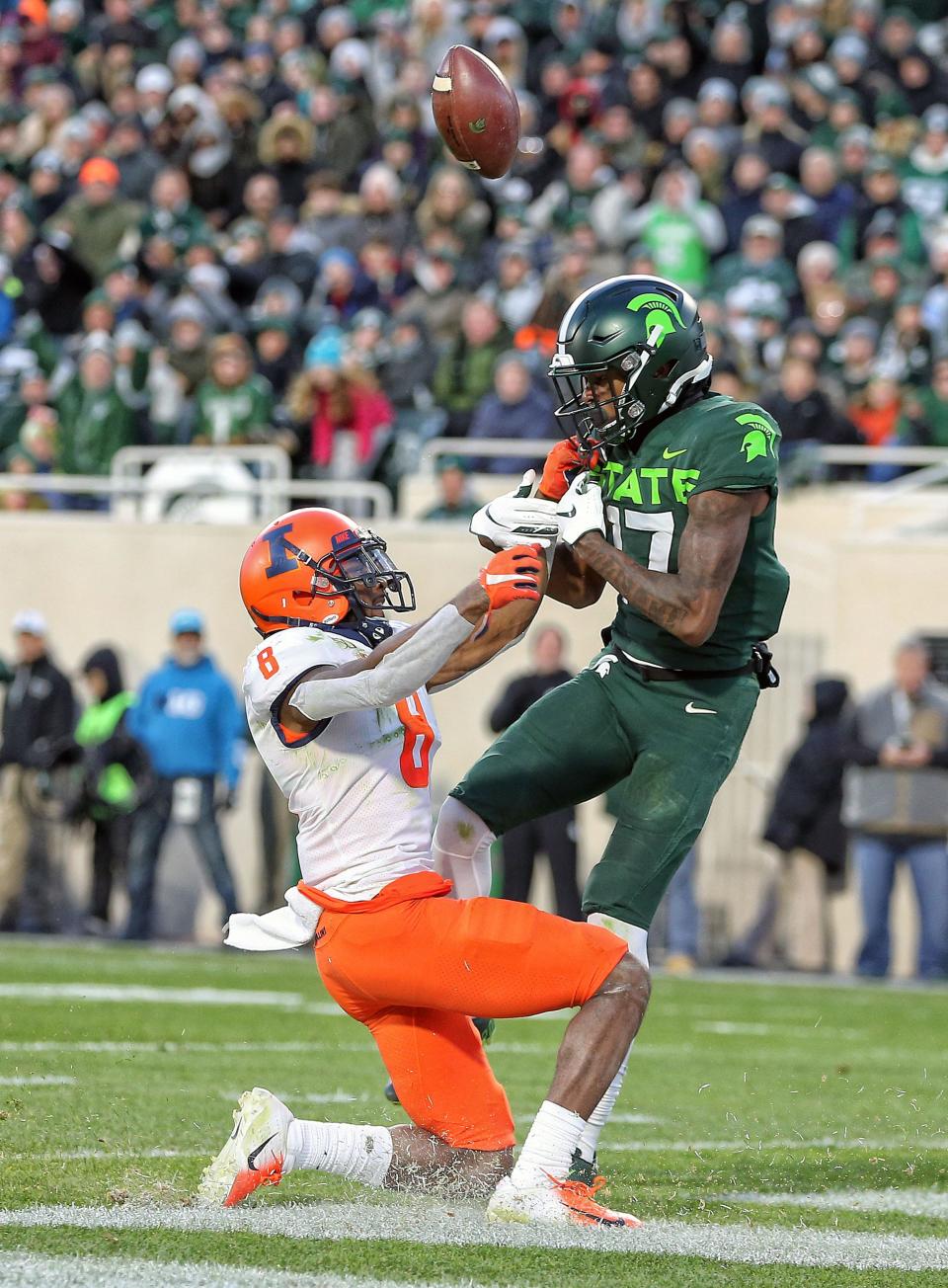 Nov 9, 2019; East Lansing, MI, USA; Illinois Fighting Illini defensive back Nate Hobbs (8) breaks up a pass intended for Michigan State Spartans wide receiver Tre Mosley (17) during the first half at Spartan Stadium. Mandatory Credit: Mike Carter-USA TODAY Sports