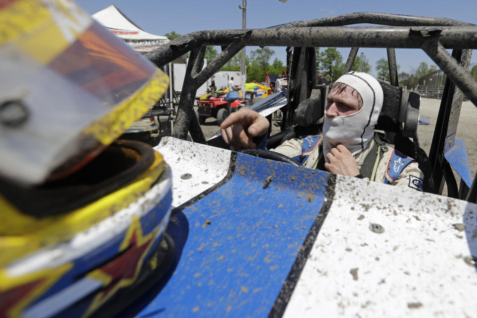 Cole Ketchum waits in his car before a practice session at Gas City I-69 Speedway, Sunday, May 24, 2020, in Gas City, Ind. (AP Photo/Darron Cummings)