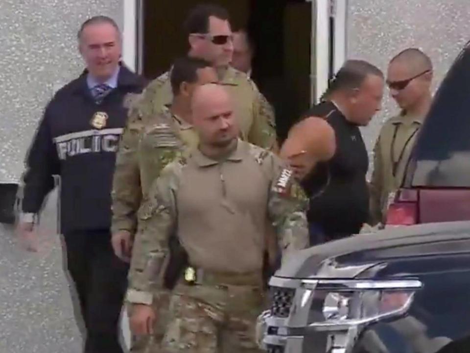 Cesar Sayoc is escorted from an FBI facility in Miramar, Florida. (REUTERS)