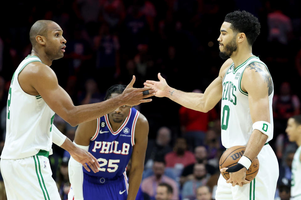 PHILADELPHIA, PENNSYLVANIA – MAY 11: <a class="link " href="https://sports.yahoo.com/nba/players/4245" data-i13n="sec:content-canvas;subsec:anchor_text;elm:context_link" data-ylk="slk:Al Horford;sec:content-canvas;subsec:anchor_text;elm:context_link;itc:0">Al Horford</a> #42 and Jayson Tatum #0 of the Boston Celtics celebrate after defeating the <a class="link " href="https://sports.yahoo.com/nba/teams/philadelphia/" data-i13n="sec:content-canvas;subsec:anchor_text;elm:context_link" data-ylk="slk:Philadelphia 76ers;sec:content-canvas;subsec:anchor_text;elm:context_link;itc:0">Philadelphia 76ers</a> in game six in the Eastern Conference Semifinals in the 2023 NBA Playoffs at Wells Fargo Center on May 11, 2023, in Philadelphia, Pennsylvania. (Photo by Tim Nwachukwu/Getty Images)