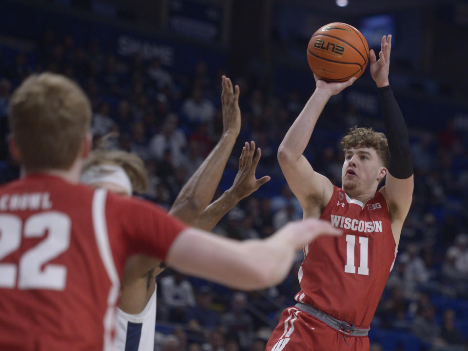 Wisconsin's Max Klesmit (11) pulls up to shoot against Penn State during the first half of an NCAA college basketball game, Wednesday, Feb. 8, 2023, in State College, Pa. (AP Photo/Gary M. Baranec)