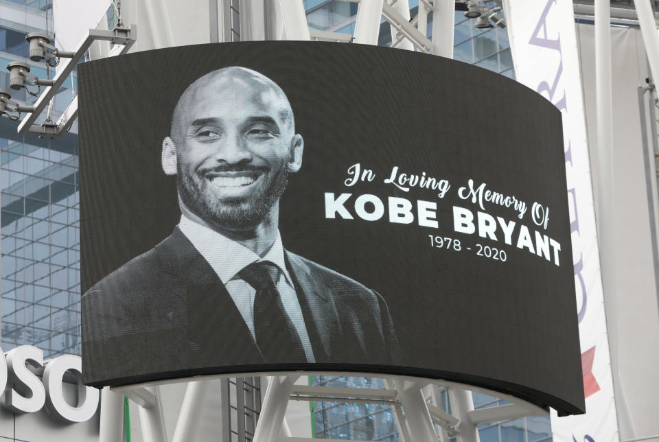 An image of Kobe Bryant is shown on a large screen outside the Staples Center after the retired Los Angeles Lakers basketball star was killed in a helicopter crash, in Los Angeles, California, U.S. January 26, 2020. REUTERS/Monica Almeida