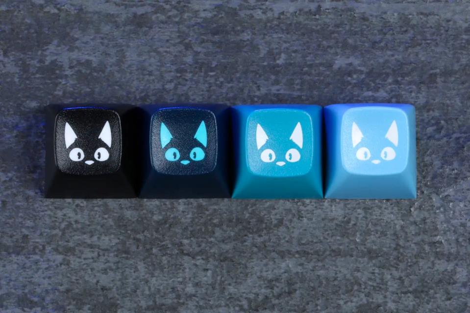 four cat themed keycaps