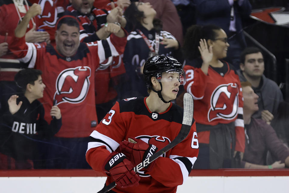 New Jersey Devils left wing Jesper Bratt reacts after scoring a goal against the Carolina Hurricanes during the first period of an NHL hockey game, Sunday, March 12, 2023, in Newark, N.J. (AP Photo/Adam Hunger)