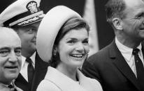 <p>Jacqueline Kennedy is photographed wearing another beautiful pillbox hat and coat at the launching of the <em>USS Lafayette </em>submarine.</p>